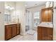 Bright bathroom featuring double sinks, a glass-enclosed shower, and ample cabinet space at 286 Liverpool Rd, Rock Hill, SC 29730