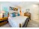 Comfortable bedroom with a wooden bed, a vibrant piece of artwork, and a bedside table at 286 Liverpool Rd, Rock Hill, SC 29730