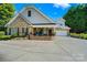 Charming brick home features a two-car garage, large front porch, and well-maintained landscaping at 286 Liverpool Rd, Rock Hill, SC 29730