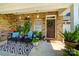 Inviting front porch with seating, plants, and a decorative wreath on the front door at 286 Liverpool Rd, Rock Hill, SC 29730