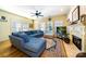 Cozy living room boasts hardwood floors, fireplace, and a comfortable blue sectional sofa at 286 Liverpool Rd, Rock Hill, SC 29730