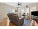 Bright living room featuring hardwood floors, a comfortable couch, and large windows for natural light at 286 Liverpool Rd, Rock Hill, SC 29730