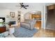 Cozy living room with a fireplace, built-in bookshelves, and hardwood floors leading to an open kitchen at 286 Liverpool Rd, Rock Hill, SC 29730