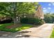 Well-maintained yard with lush green grass, mature trees, and manicured bushes surrounding this lovely home at 286 Liverpool Rd, Rock Hill, SC 29730