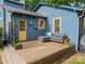 Well-maintained backyard deck with seating and blue exterior, ideal for outdoor enjoyment at 2915 Wesley Ave, Charlotte, NC 28205
