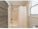 Clean bathroom with a shower-tub combo, subway tile, and neutral wall color at 2915 Wesley Ave, Charlotte, NC 28205