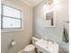 Bright bathroom with a pedestal sink and neutral wall color at 2915 Wesley Ave, Charlotte, NC 28205