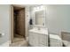 Clean bathroom featuring a tiled shower, modern vanity, and neutral color palette at 2915 Wesley Ave, Charlotte, NC 28205