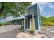 Two-story home featuring a striking yellow front door, colorful flowers, and landscaped front yard at 2915 Wesley Ave, Charlotte, NC 28205