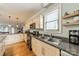 Bright kitchen featuring stainless steel appliances, granite countertops and a window with sunlit view at 2915 Wesley Ave, Charlotte, NC 28205
