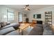 Inviting living room featuring hardwood floors, comfortable seating, and natural light from a large window at 2915 Wesley Ave, Charlotte, NC 28205