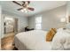 Comfortable main bedroom with wood floors, ensuite bathroom, ceiling fan and natural light at 2915 Wesley Ave, Charlotte, NC 28205