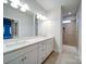 Bathroom with dual sink vanity, tile floors, and a walk-in shower featuring tiled walls and a view to another room at 3069 Founding Fathers Dr, Gastonia, NC 28056