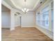 Dining room featuring wood-look flooring, large windows, and chandelier at 3069 Founding Fathers Dr, Gastonia, NC 28056