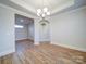 Dining room showing wood-look flooring and chandelier at 3069 Founding Fathers Dr, Gastonia, NC 28056