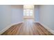 Hallway view into a sunlit room, showing new hardwood floors and ample space at 3069 Founding Fathers Dr, Gastonia, NC 28056