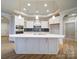 A kitchen showcasing stainless appliances, a large island, and modern pendant lighting at 3069 Founding Fathers Dr, Gastonia, NC 28056