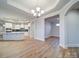 Spacious open concept kitchen with island and modern appliances, seamlessly connected to the living area at 3069 Founding Fathers Dr, Gastonia, NC 28056