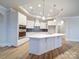 This kitchen has stainless appliances, a large island, and stylish pendant lighting at 3069 Founding Fathers Dr, Gastonia, NC 28056