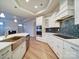 Open concept kitchen featuring stainless appliances, island, tile backsplash, and wood floors at 3069 Founding Fathers Dr, Gastonia, NC 28056