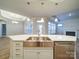 A kitchen island featuring a stainless sink and dishwasher, with pendant lights overhead at 3069 Founding Fathers Dr, Gastonia, NC 28056