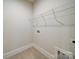 Functional laundry room with shelving for storage and tile floors at 3069 Founding Fathers Dr, Gastonia, NC 28056