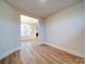 Inviting room with hardwood floors and an open doorway to a sunny area with large windows at 3069 Founding Fathers Dr, Gastonia, NC 28056
