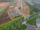 An aerial view shows a home with landscaping adjacent to new construction in a growing residential community at 3089 Founding Fathers Dr, Gastonia, NC 28056