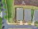 An overhead aerial view shows a landscaped yard with patio of gray roofed home in a planned residential community at 3089 Founding Fathers Dr, Gastonia, NC 28056