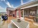 Charming backyard patio with a built-in fireplace, comfortable seating, and screened-in porch for relaxing outdoors at 3089 Founding Fathers Dr, Gastonia, NC 28056
