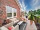 Backyard patio has a seating area and is surrounded by a black metal fence and is perfect for outdoor relaxation at 3089 Founding Fathers Dr, Gastonia, NC 28056