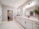 A spacious bathroom includes double sinks with a central cabinet for added storage at 3089 Founding Fathers Dr, Gastonia, NC 28056