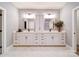 This bathroom has double sinks, white cabinetry, and stylish hardware at 3089 Founding Fathers Dr, Gastonia, NC 28056