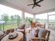 Inviting covered patio offers comfortable seating and a dining area, perfect for enjoying the outdoor views at 3089 Founding Fathers Dr, Gastonia, NC 28056