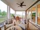 Stylish covered patio with comfortable seating, dining table, and scenic views creates an inviting outdoor space at 3089 Founding Fathers Dr, Gastonia, NC 28056