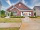 Charming single-story brick home featuring a welcoming entrance and manicured landscaping at 3089 Founding Fathers Dr, Gastonia, NC 28056