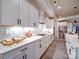 Bright kitchen showcases modern white cabinets, stainless appliances, white countertops, and tiled backsplash for a clean style at 3089 Founding Fathers Dr, Gastonia, NC 28056