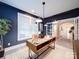 Home office featuring blue walls, lots of natural light, and an eye-catching desk at 3089 Founding Fathers Dr, Gastonia, NC 28056