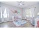 Charming bedroom with bright decor, wood-look floors, and plenty of natural light at 325 Cornwall Dr, Salisbury, NC 28147