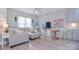 Open living area with gray sectional, mounted TV, and floral artwork at 325 Cornwall Dr, Salisbury, NC 28147