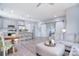 Open-concept living space with modern furnishings, kitchen island and light gray walls at 325 Cornwall Dr, Salisbury, NC 28147
