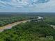 An aerial view of the property showing a river winding through dense woodlands, offering scenic views at 3387 Passmore Rd, Rock Hill, SC 29730