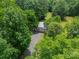 Aerial shot of metal building surrounded by lush, green trees at 3387 Passmore Rd, Rock Hill, SC 29730