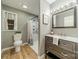 Neutral bathroom with wood floors, modern vanity with drawers, and shower with curtain at 3387 Passmore Rd, Rock Hill, SC 29730
