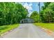 Exterior view of a Quonset hut-style building with a paved driveway at 3387 Passmore Rd, Rock Hill, SC 29730