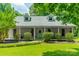 Inviting home featuring dormer windows, a well-maintained lawn, and a cozy front porch at 3387 Passmore Rd, Rock Hill, SC 29730