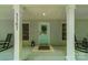 Inviting front porch with rocking chairs, a teal door with wreath, and a welcome mat at 3387 Passmore Rd, Rock Hill, SC 29730