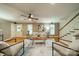 Bright living room with hardwood floors, a ceiling fan, a staircase, and neutral decor at 3387 Passmore Rd, Rock Hill, SC 29730