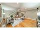 Spacious living room featuring hardwood floors, neutral-toned furniture, and a staircase at 3387 Passmore Rd, Rock Hill, SC 29730