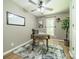 Home office with wood floors, modern desk, decorative rug, and natural light at 3387 Passmore Rd, Rock Hill, SC 29730
